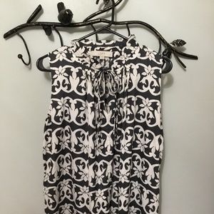 Loft sleeveless blouse with ruffled neckline and tie closures